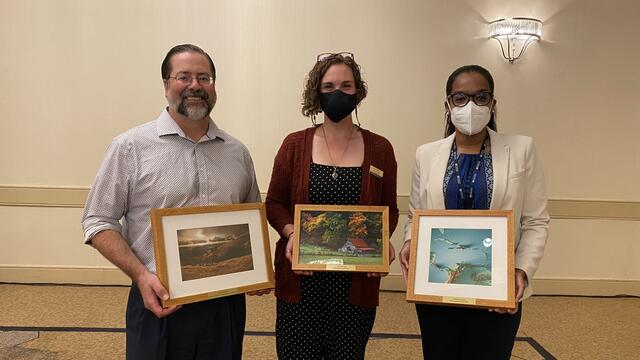 Engle poses with her AESS award between two other awardees.