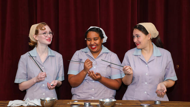 Margaret Riekenberg as Grace, Laisha Monteiro as Kathryn, and Madison Dehais as Irene in McDaniel College’s production of “Radium Girls.”