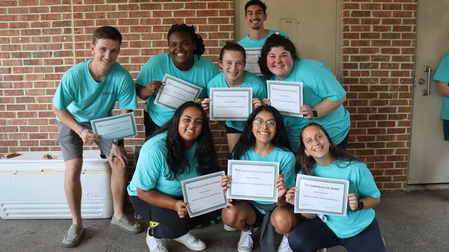 A group of people in blue 