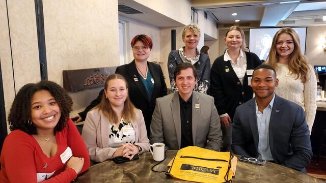 Students at an event with the President of McDaniel College.