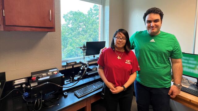 Professor Farzad Ahmadi stands with student Tania Mendez-Perez in the lab.