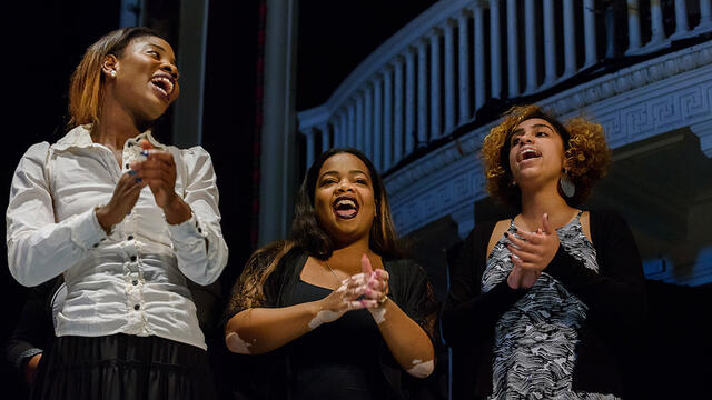Three women singing in the McDaniel College Gospel Choir.