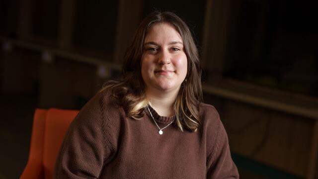 Headshot of Ashleigh Lobbins sitting indoors.