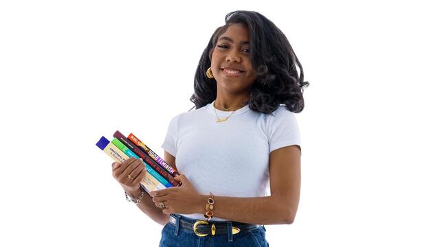 Janiah Field holding textbooks