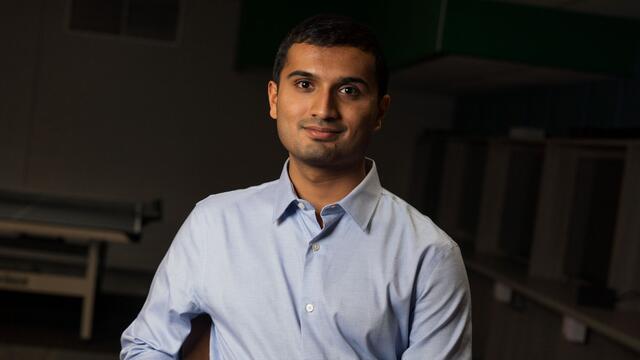 Portrait of Nikhil Niyogi. He is wearing a blue button-down shirt.