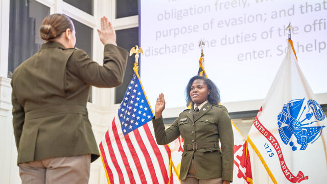 A female cadet takes the Oath of Office.