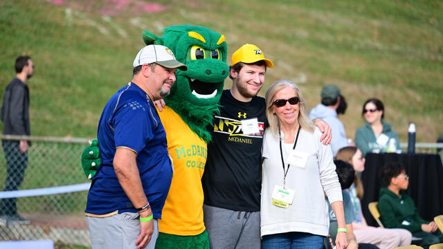 A family with the Green Terror during Parent & Family Weekend.