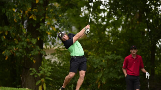 Golfers on a course.