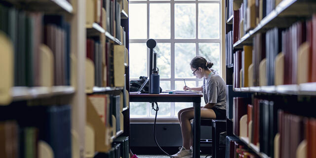 Student in Hoover Library.