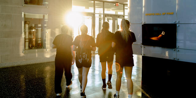 Female athletes walking together in Gill Center.