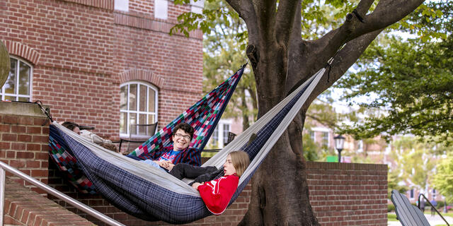 Students in hammocks on campus.