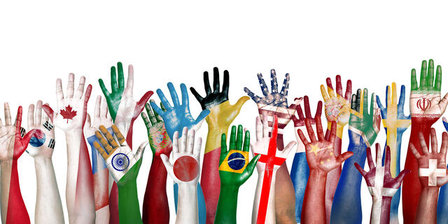 Group of Diverse Flag Painted Hands Raised