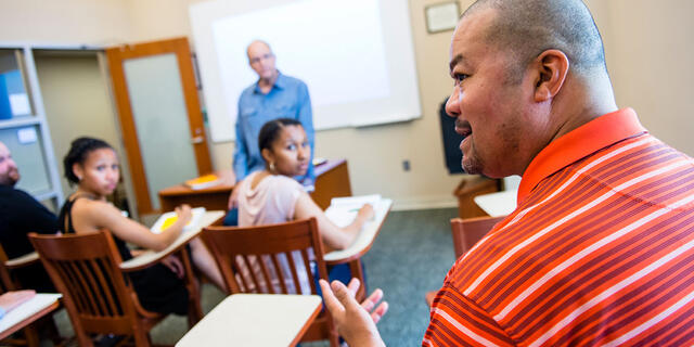 Grad students in classroom.