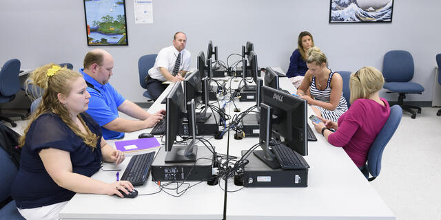 Grad students in classroom.