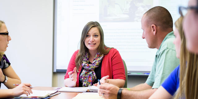 Grad students in classroom.