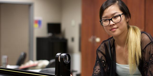 Student in Physics lab.