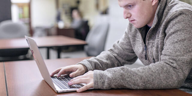Student on computer.