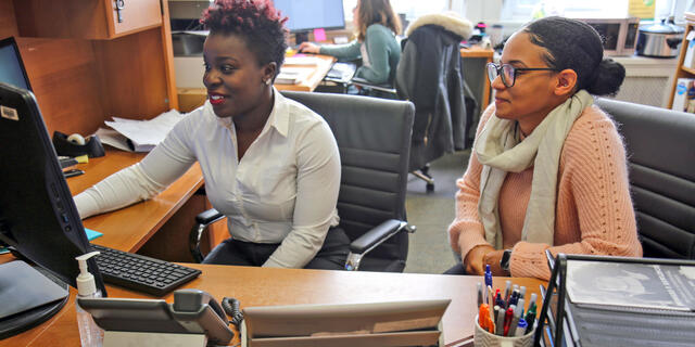 McDaniel College Financial Aid Director Kemia Himon assists Financial Aid Specialist Aza Smith