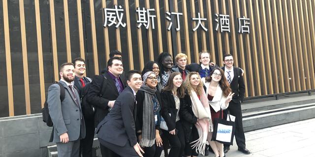 students pose at Model United Nations in China